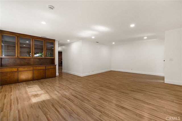 178 E Washington Ave, Chico, CA 95926 - unfurnished room with a smoke detector, light wood finished floors, recessed lighting, and baseboards