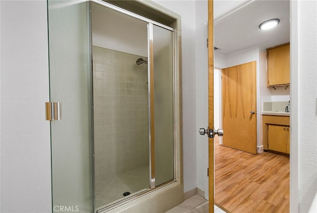 178 E Washington Ave, Chico, CA 95926 - bathroom with a stall shower, vanity, and wood finished floors