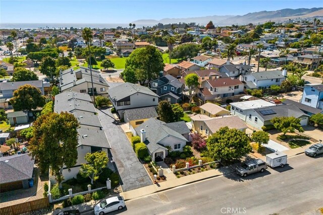 243 N 11th St, Grover Beach, CA 93433 - aerial perspective of suburban area with a mountainous background