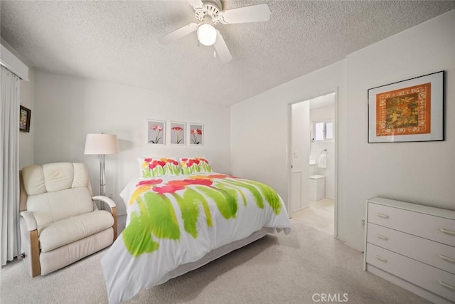 243 N 11th St, Grover Beach, CA 93433 - bedroom with a textured ceiling, carpet floors, ensuite bathroom, and a ceiling fan