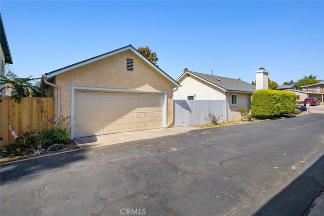 243 N 11th St, Grover Beach, CA 93433 - view of front of property featuring stucco siding and a detached garage