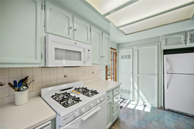 243 N 11th St, Grover Beach, CA 93433 - kitchen featuring white appliances, light countertops, and tasteful backsplash