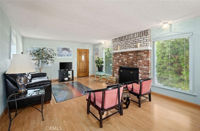 243 N 11th St, Grover Beach, CA 93433 - living area with wood finished floors, a textured ceiling, and healthy amount of natural light