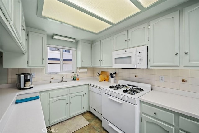 243 N 11th St, Grover Beach, CA 93433 - kitchen featuring white appliances, decorative backsplash, and light countertops