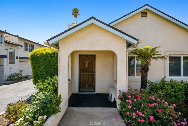243 N 11th St, Grover Beach, CA 93433 - doorway to property featuring stucco siding