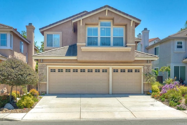 11983 Mountain Pass Rd, San Diego, CA 92128 - view of front facade with concrete driveway, a tile roof, stucco siding, and a garage