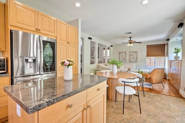 11983 Mountain Pass Rd, San Diego, CA 92128 - kitchen with appliances with stainless steel finishes, light brown cabinetry, open floor plan, plenty of natural light, and recessed lighting