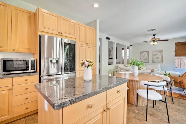 11983 Mountain Pass Rd, San Diego, CA 92128 - kitchen with stainless steel appliances, light brown cabinets, open floor plan, a kitchen island, and ceiling fan