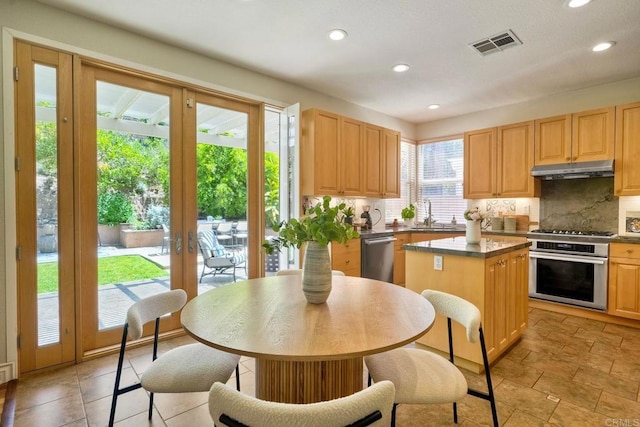 11983 Mountain Pass Rd, San Diego, CA 92128 - kitchen featuring stainless steel appliances, french doors, tasteful backsplash, a center island, and recessed lighting