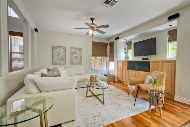 11983 Mountain Pass Rd, San Diego, CA 92128 - living area with light wood-style floors, a ceiling fan, and baseboards