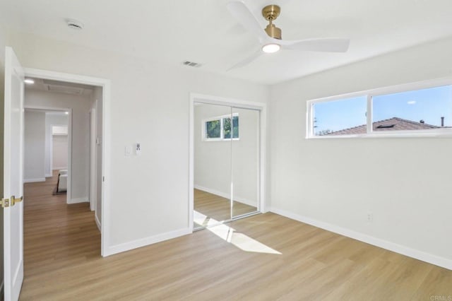 1740 Petra Dr, San Diego, CA 92104 - unfurnished bedroom featuring light wood finished floors, baseboards, a closet, and a ceiling fan
