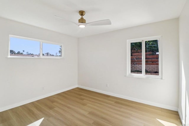 1740 Petra Dr, San Diego, CA 92104 - empty room with healthy amount of natural light, light wood-type flooring, and baseboards