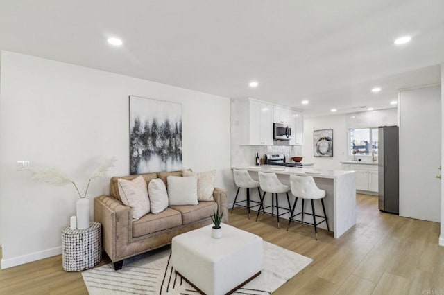 1740 Petra Dr, San Diego, CA 92104 - living room with light wood-type flooring and recessed lighting