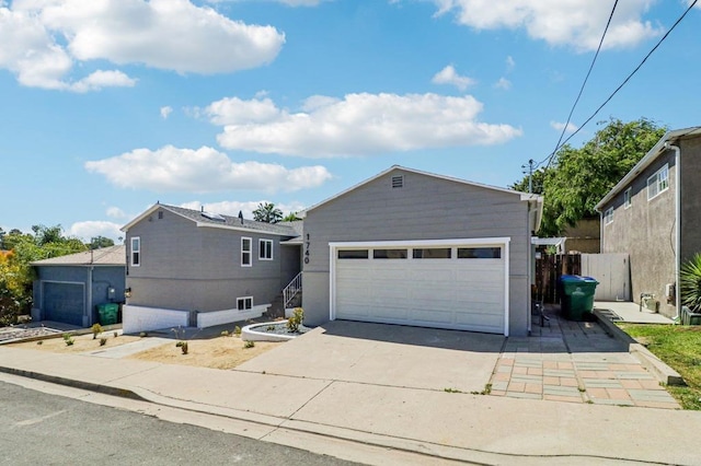 1740 Petra Dr, San Diego, CA 92104 - ranch-style home with concrete driveway and an attached garage