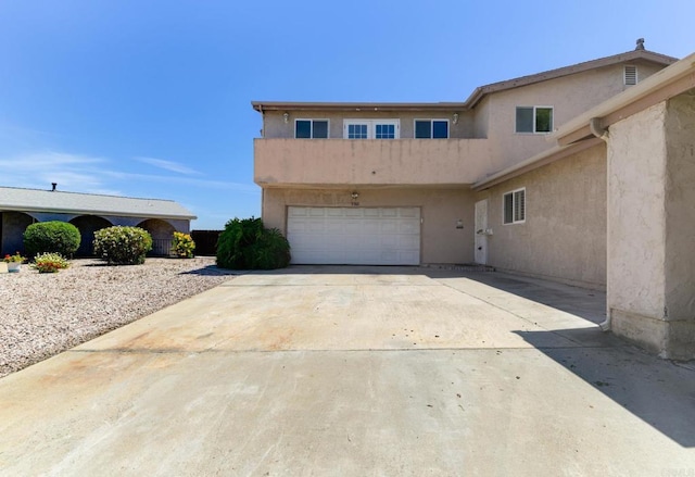 9182 Tonya Ln, Santee, CA 92071 - view of front of home with stucco siding, a garage, and concrete driveway