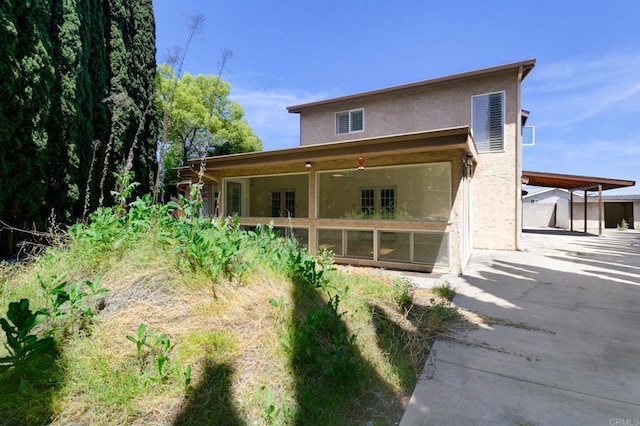 9182 Tonya Ln, Santee, CA 92071 - rear view of property featuring stucco siding and driveway