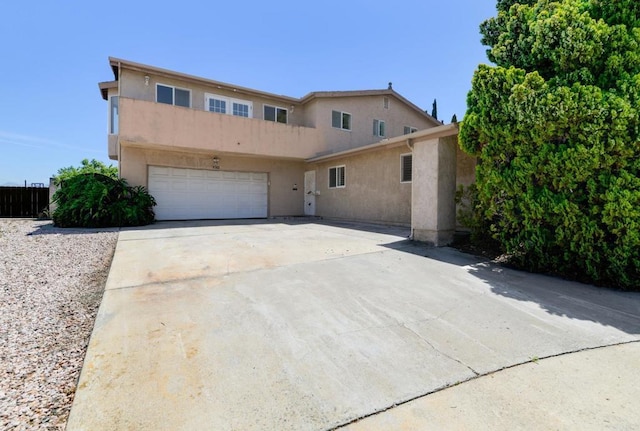 9182 Tonya Ln, Santee, CA 92071 - view of front of home featuring stucco siding, a garage, and driveway