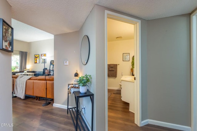 1772 Sinaloa Rd Unit 290, Simi Valley, CA 93065 - hall featuring dark wood finished floors, a textured ceiling, and baseboards