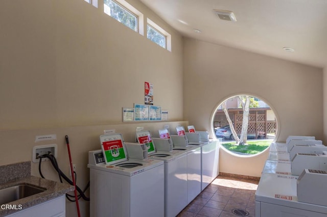 1772 Sinaloa Rd Unit 290, Simi Valley, CA 93065 - shared laundry room with washer and dryer, plenty of natural light, and dark tile patterned flooring
