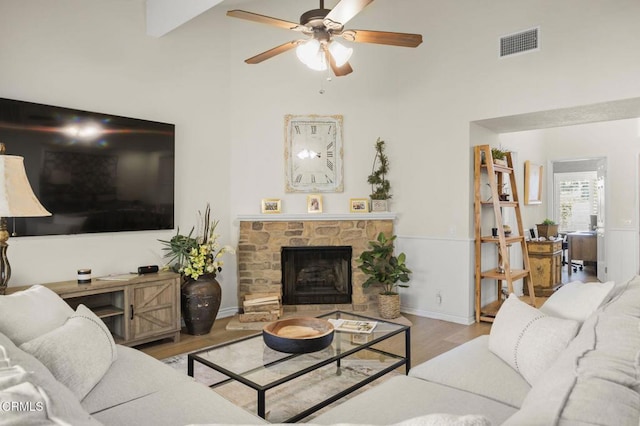 2036 Birchdale Ct, Thousand Oaks, CA 91362 - living area with wood finished floors, a ceiling fan, a high ceiling, and a fireplace
