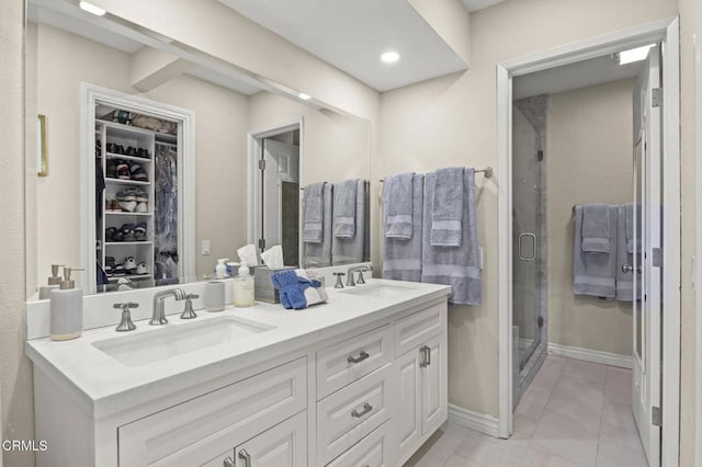 2036 Birchdale Ct, Thousand Oaks, CA 91362 - full bath featuring a stall shower, double vanity, a spacious closet, baseboards, and recessed lighting