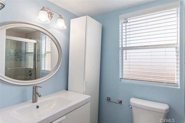 1250 Cleveland Ave Unit C314, San Diego, CA 92103 - bathroom with toilet, vanity, and a shower stall