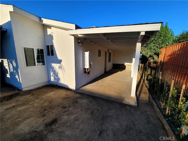 15330 Hart St, Van Nuys, CA 91406 - rear view of house with stucco siding and a carport