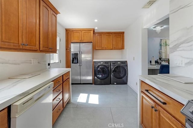 15330 Hart St, Van Nuys, CA 91406 - laundry room featuring separate washer and dryer, light tile patterned floors, and recessed lighting