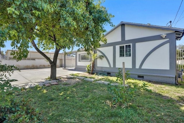 15330 Hart St, Van Nuys, CA 91406 - rear view of property featuring a patio, crawl space, and stucco siding