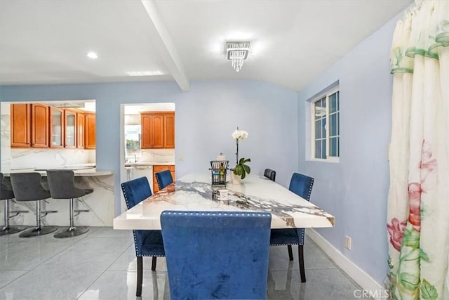 15330 Hart St, Van Nuys, CA 91406 - dining room featuring beamed ceiling and baseboards