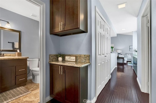 6223 Newhaven Ct, Yorba Linda, CA 92887 - bathroom with toilet, vanity, and baseboards