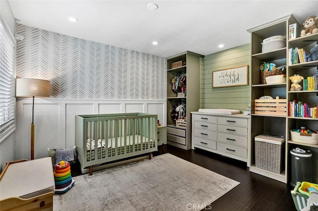 6223 Newhaven Ct, Yorba Linda, CA 92887 - bedroom featuring a decorative wall, a nursery area, dark wood-style floors, and recessed lighting