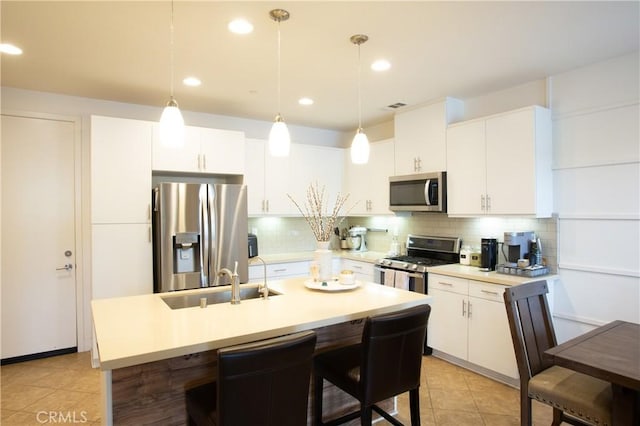 16 Fenix St, Rancho Mission Viejo, CA 92694 - kitchen featuring stainless steel appliances, a sink, tasteful backsplash, light countertops, and recessed lighting