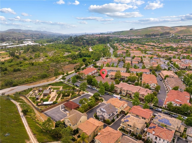 16 Fenix St, Rancho Mission Viejo, CA 92694 - aerial overview of property's location featuring a mountainous background and nearby suburban area
