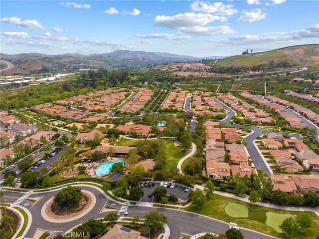 16 Fenix St, Rancho Mission Viejo, CA 92694 - aerial view of property and surrounding area featuring a mountainous background and nearby suburban area