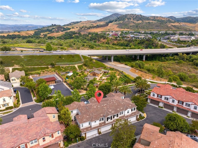 16 Fenix St, Rancho Mission Viejo, CA 92694 - aerial view of residential area with a mountain backdrop and a notable bridge