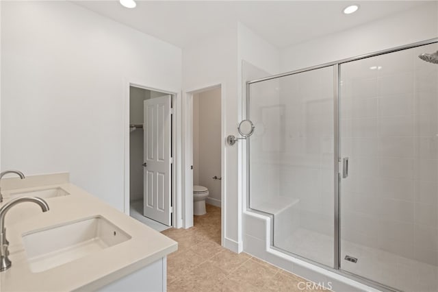 16 Fenix St, Rancho Mission Viejo, CA 92694 - bathroom with a stall shower, double vanity, toilet, tile patterned floors, and recessed lighting