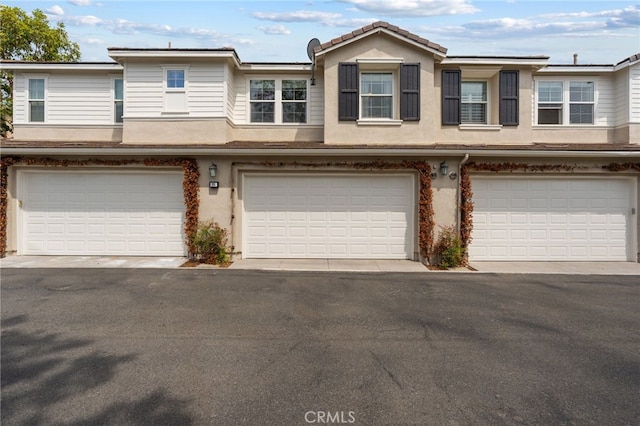 16 Fenix St, Rancho Mission Viejo, CA 92694 - townhome / multi-family property with an attached garage and stucco siding