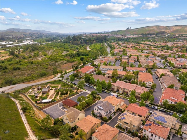 16 Fenix St, Rancho Mission Viejo, CA 92694 - aerial view of property and surrounding area with a mountainous background and nearby suburban area