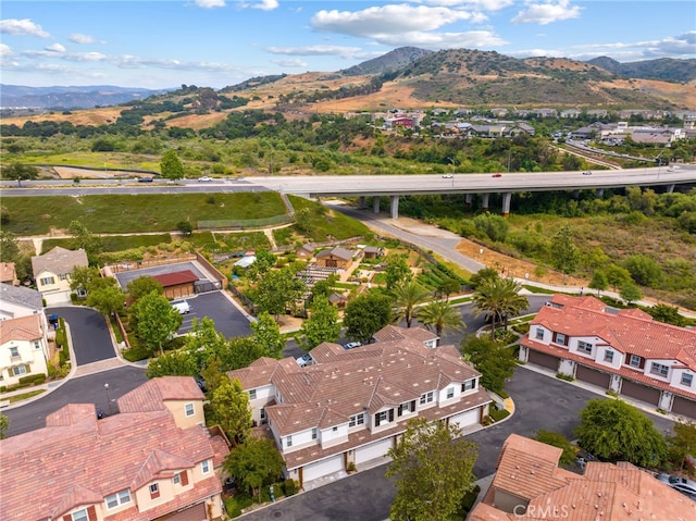 16 Fenix St, Rancho Mission Viejo, CA 92694 - aerial view of residential area with a mountainous background and a notable bridge
