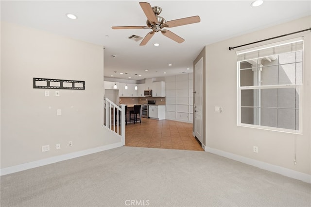 16 Fenix St, Rancho Mission Viejo, CA 92694 - unfurnished living room with light colored carpet, ceiling fan, recessed lighting, and baseboards