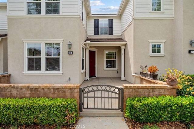 16 Fenix St, Rancho Mission Viejo, CA 92694 - property entrance with a gate and stucco siding