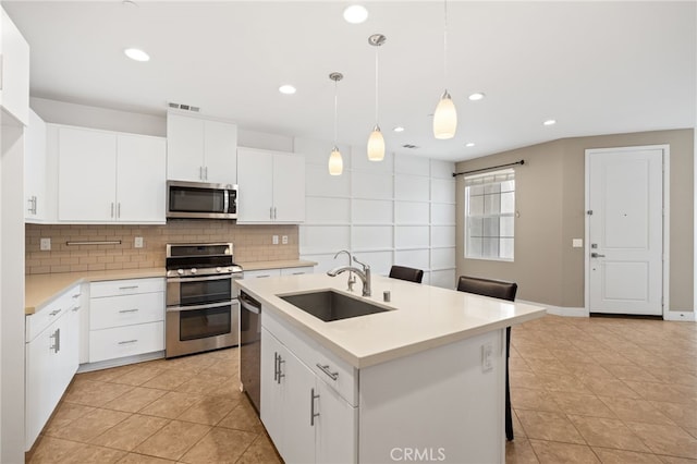 16 Fenix St, Rancho Mission Viejo, CA 92694 - kitchen featuring stainless steel appliances, a sink, backsplash, light countertops, and recessed lighting