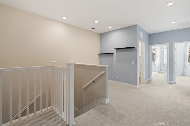 16 Fenix St, Rancho Mission Viejo, CA 92694 - hall with an upstairs landing, light carpet, recessed lighting, and baseboards