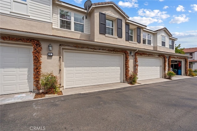 16 Fenix St, Rancho Mission Viejo, CA 92694 - view of property with stucco siding and a garage