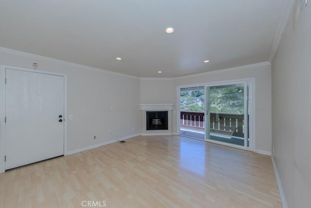 19134 Alamo Ln Unit 162, Yorba Linda, CA 92886 - unfurnished living room featuring light wood-style flooring, crown molding, baseboards, a glass covered fireplace, and recessed lighting