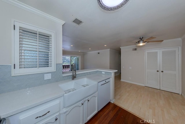 19134 Alamo Ln Unit 162, Yorba Linda, CA 92886 - kitchen with dishwasher, wood finished floors, a sink, light countertops, and crown molding