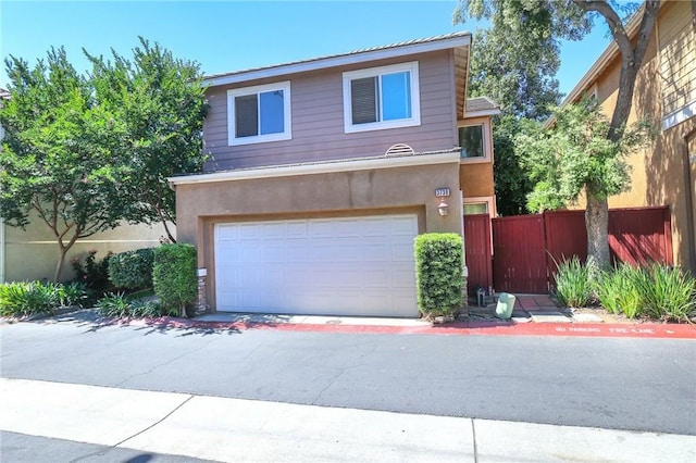 3738 Springmount St, Riverside, CA 92501 - view of front of house with an attached garage and stucco siding