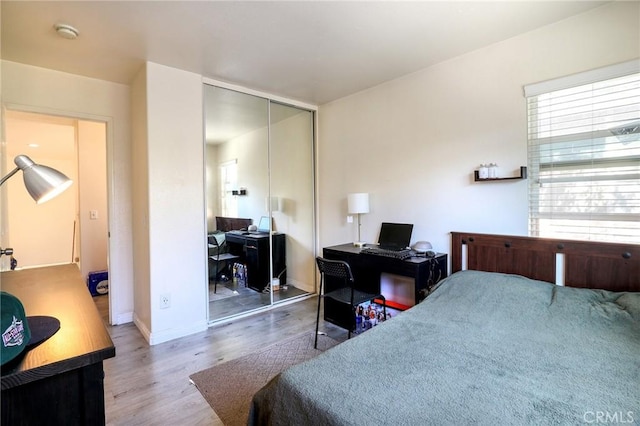 3738 Springmount St, Riverside, CA 92501 - bedroom featuring wood finished floors, a closet, an office area, and baseboards