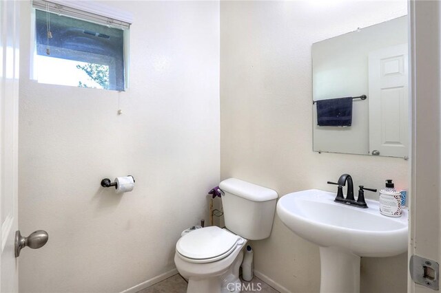 3738 Springmount St, Riverside, CA 92501 - half bathroom with toilet and baseboards